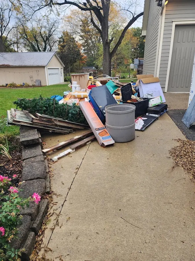 Dumpster being loaded with debris for Demolition Dumpster Rental in East Goshen